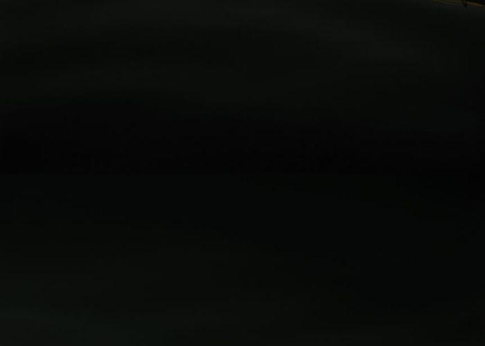 Smooth golden light patterns on dark background